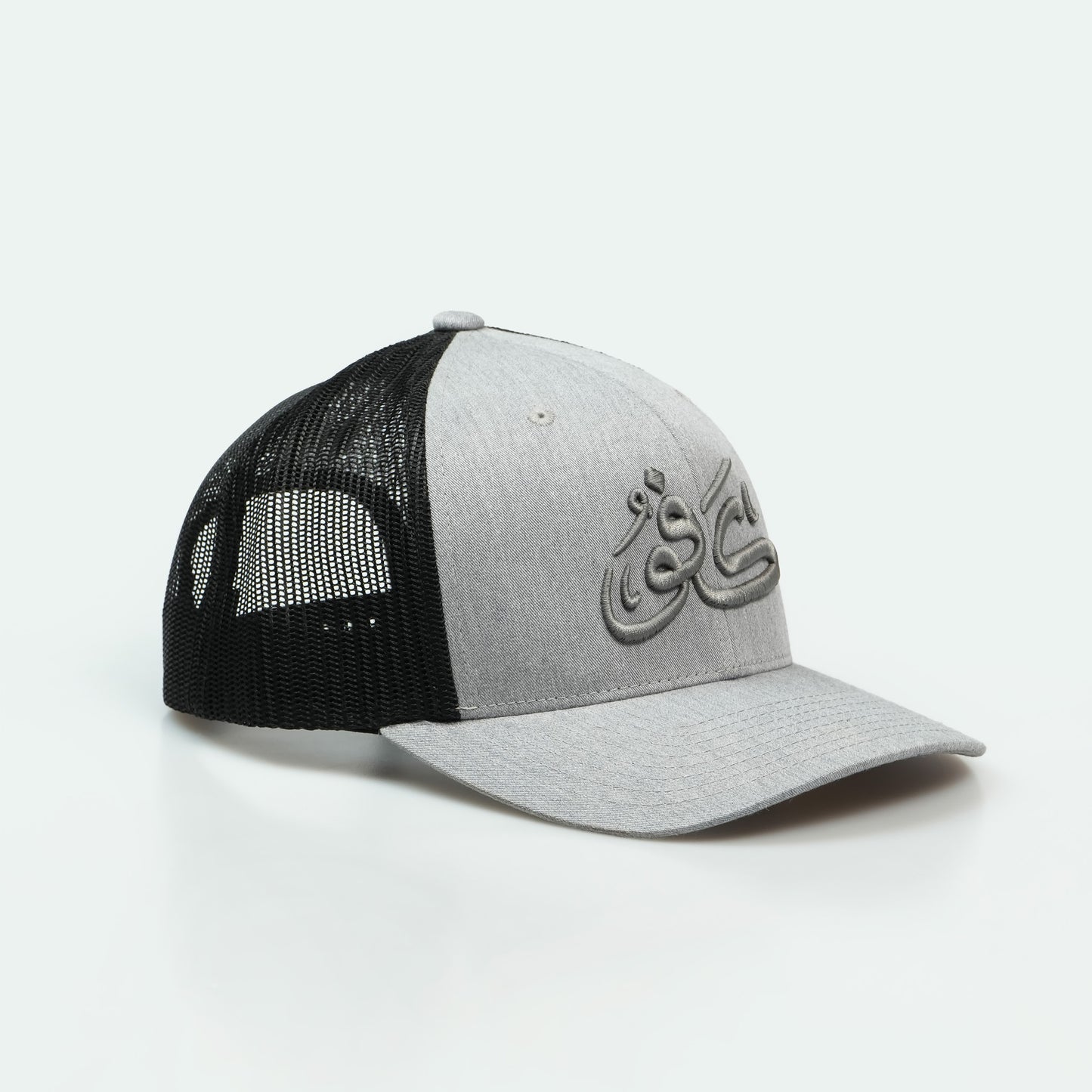 كفو Kafoo One8 Hat : trucker cap with bold Arabic lettering, symbolizing Gulf pride and respect