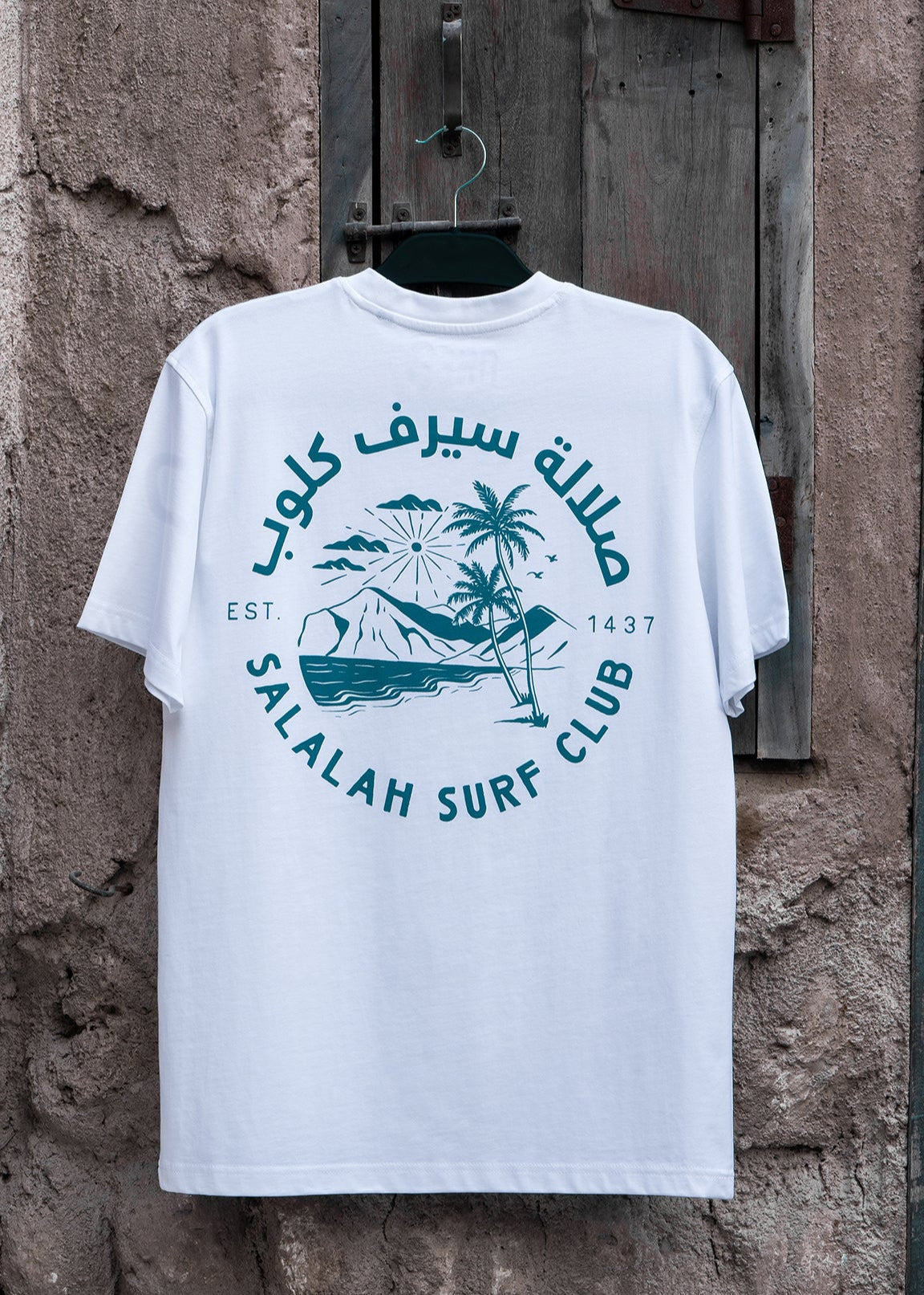 Salalah Surf Club coconut palms tee with Mughsail Beach scene, Omani culture streetwear by One8