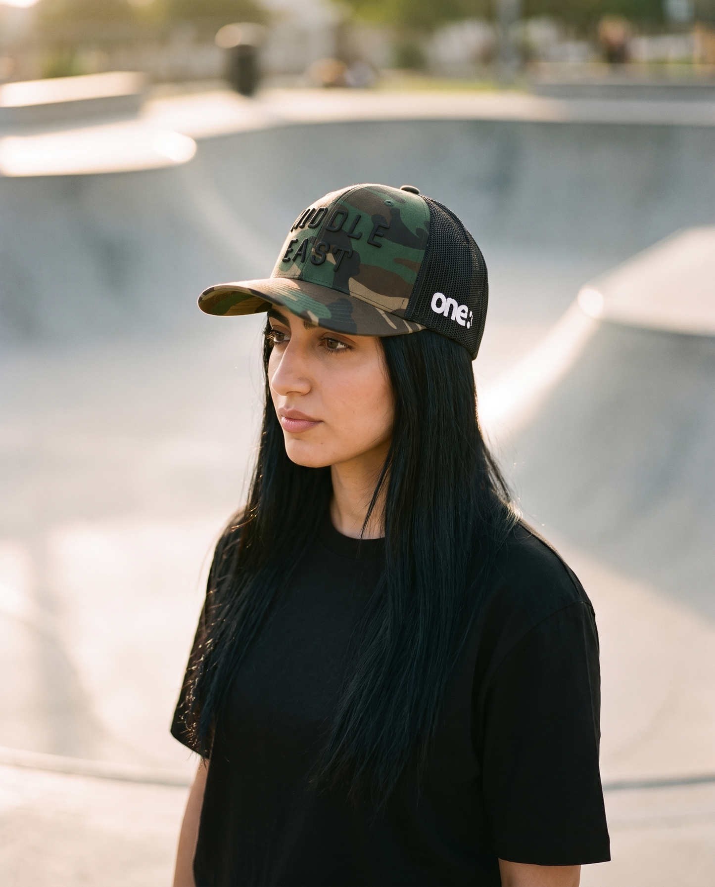 Middle East camo trucker side profile with one8 logo at the skate park