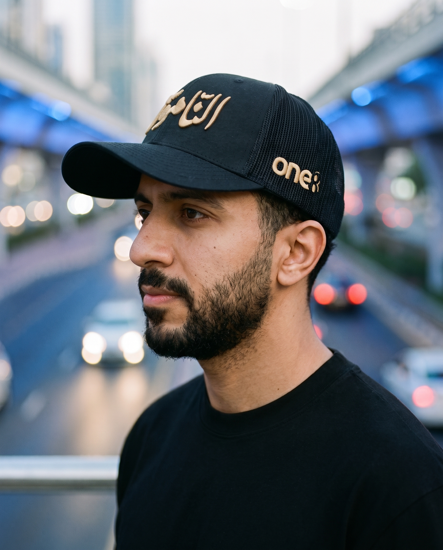 Al Namoos curved brim trucker side profile - on model