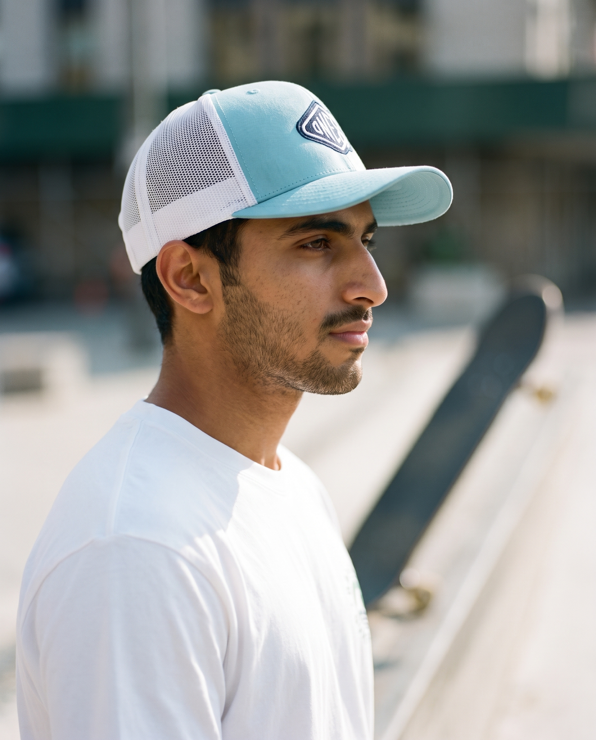 One8 Skate Logo trucker side profile - on model