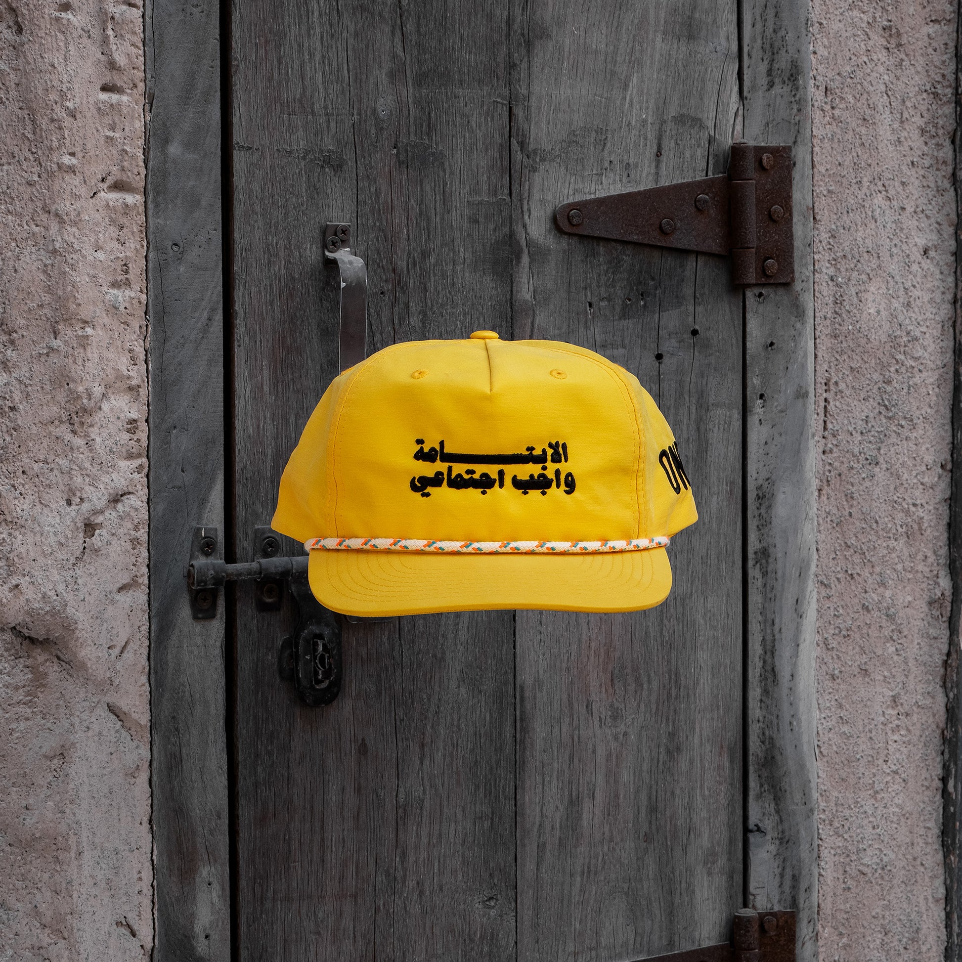 Smile الابتسامة واجب اجتماعي grandad hat with flat Arabic text, One8 cap