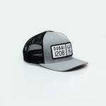 كاب دبي Dubai License Plate Curved Brim Meshback Trucker Hat - One8 Hat- Arabic pop culture