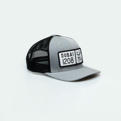 كاب دبي Dubai License Plate Curved Brim Meshback Trucker Hat - One8 Hat- Arabic pop culture