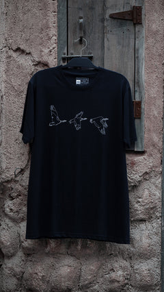 Houbara in Flight Black T-shirt - featuring a حبارى (houbara bustard)  designed by Khalid Al Astad 