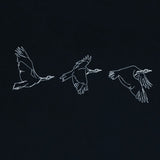 Houbara in Flight Black T-shirt - featuring a حبارى (houbara bustard)  designed by Khalid Al Astad 