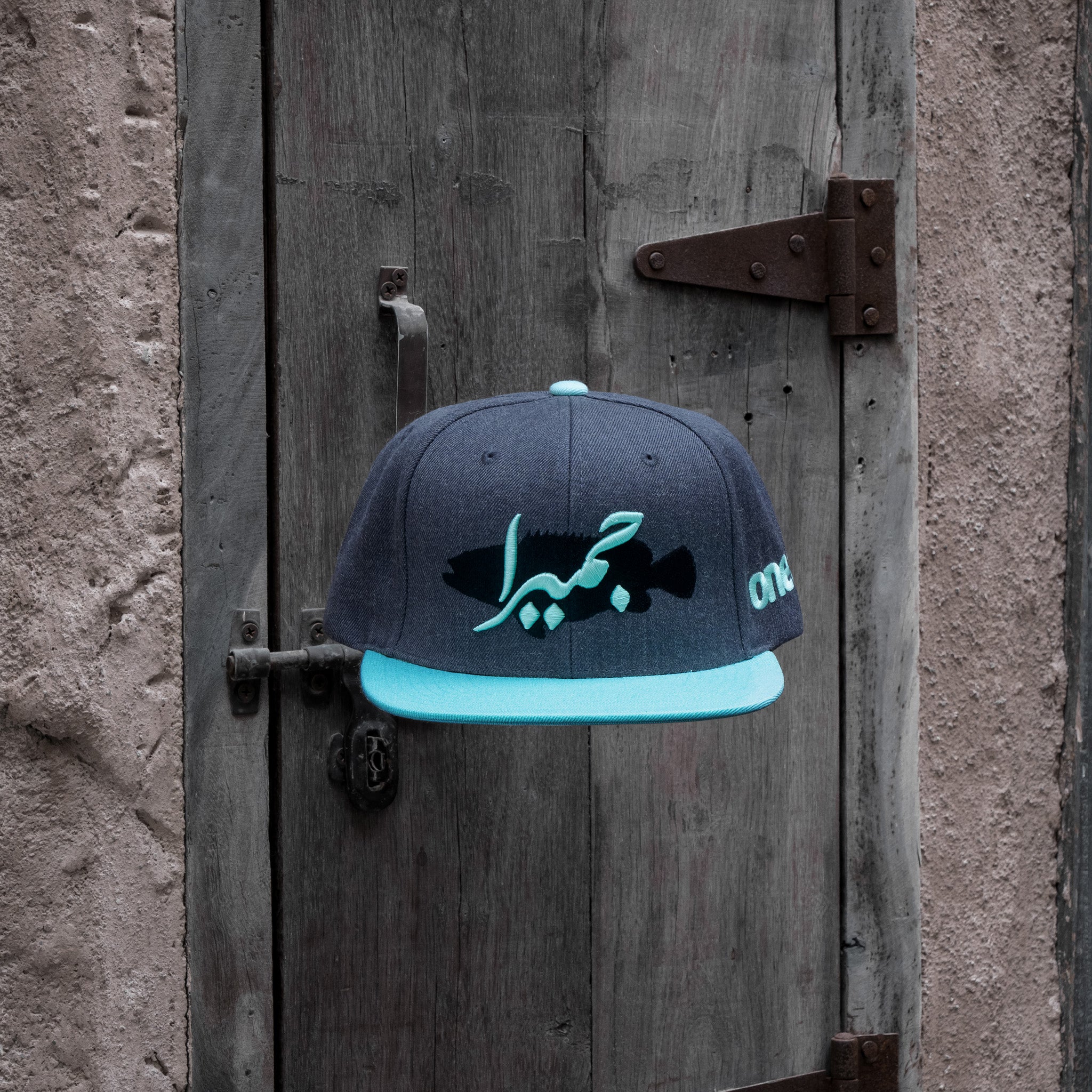 Jumeira Snapback with bold جميرا design, inspired by Dubai's laid-back coastal style One8 hat
