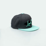 Jumeira Snapback with bold جميرا design, inspired by Dubai's laid-back coastal style One8 hat