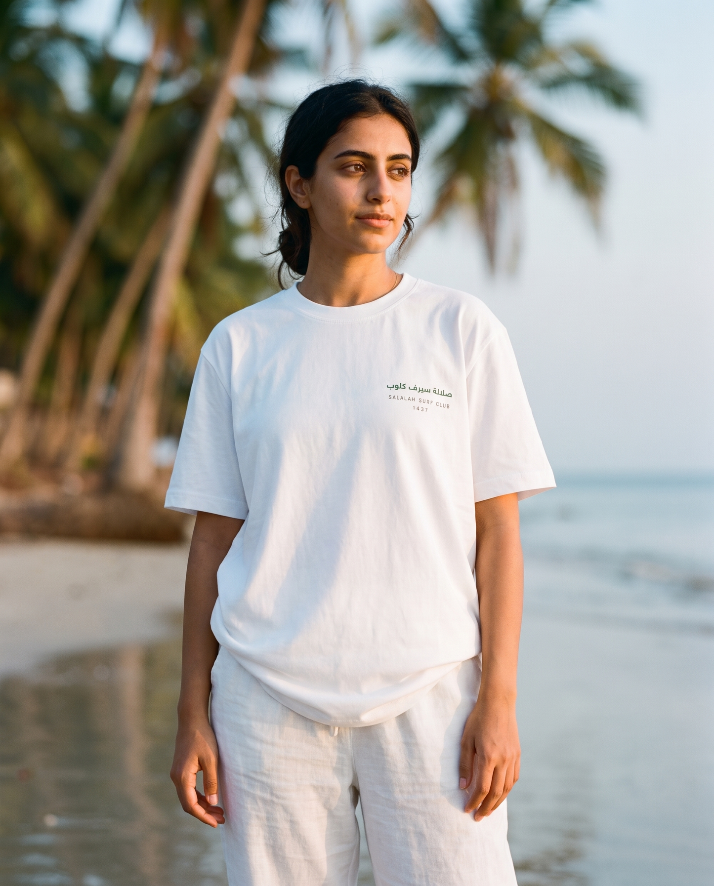 Salalah Surf Club Coconut Palms tee front chest print, female model, oversized fit