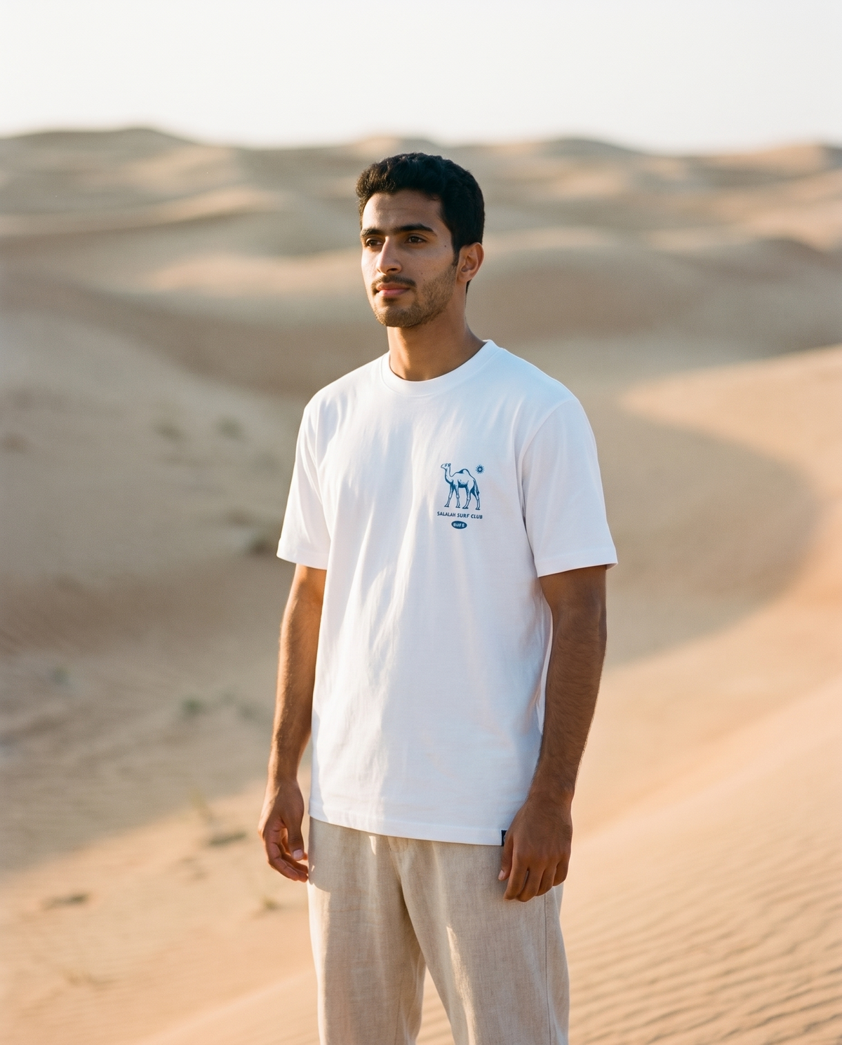 Salalah Surf Club Camel tee front chest print, male model, oversized fit