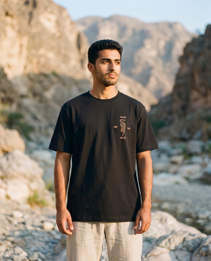 Salalah Surf Club Arabian Leopard black tee front chest print, male model, oversized fit