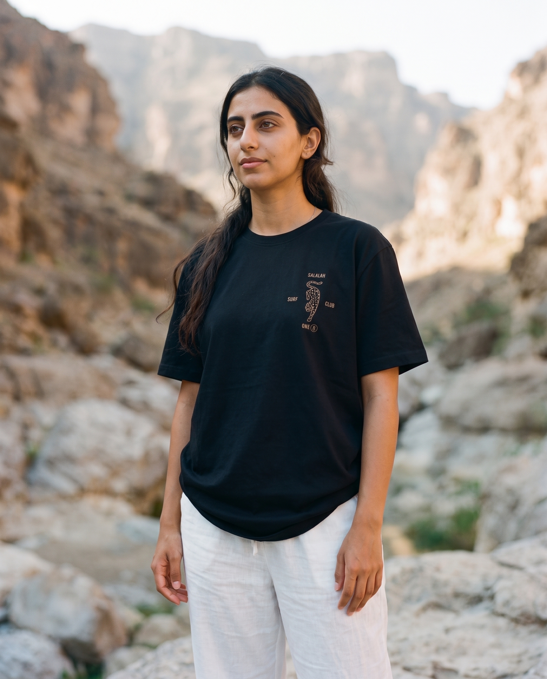 Salalah Surf Club Arabian Leopard black tee front chest print, female model, oversized fit