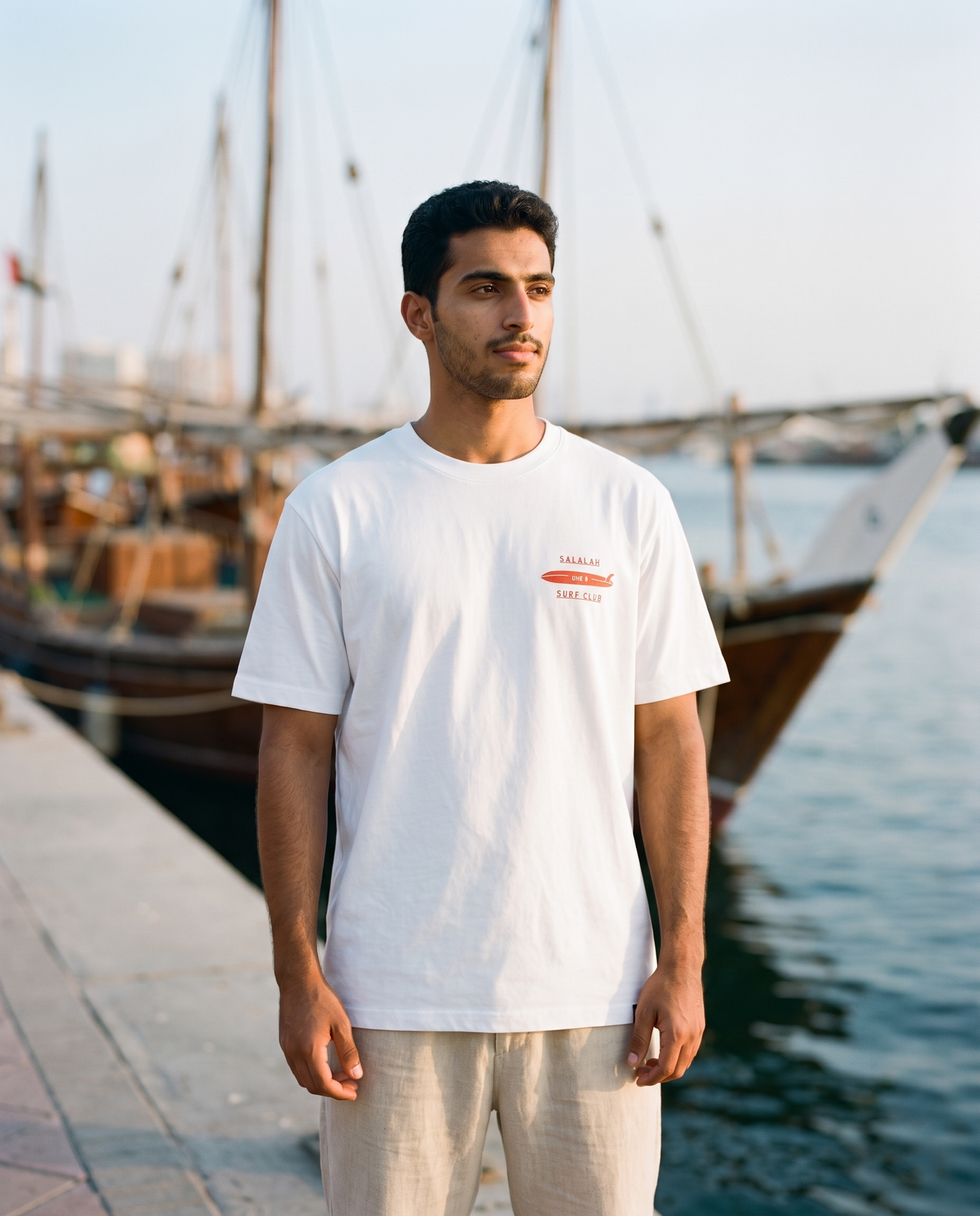 Salalah Surf Club Dhow tee front chest print, male model, oversized fit
