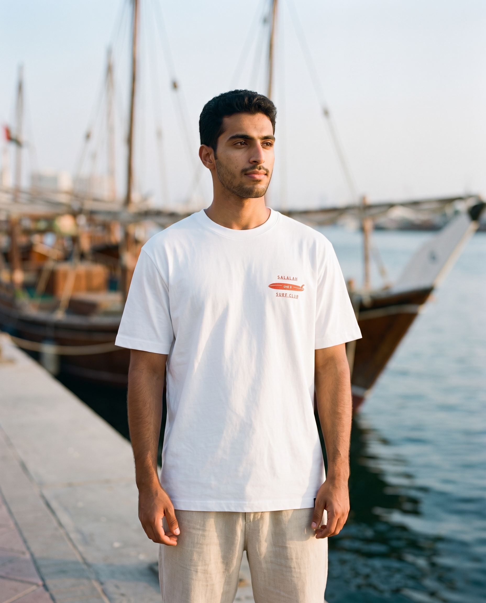 Salalah Surf Club Dhow tee front chest print, male model, oversized fit