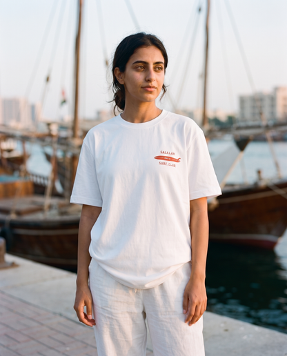 Salalah Surf Club Dhow tee front chest print, female model, oversized fit