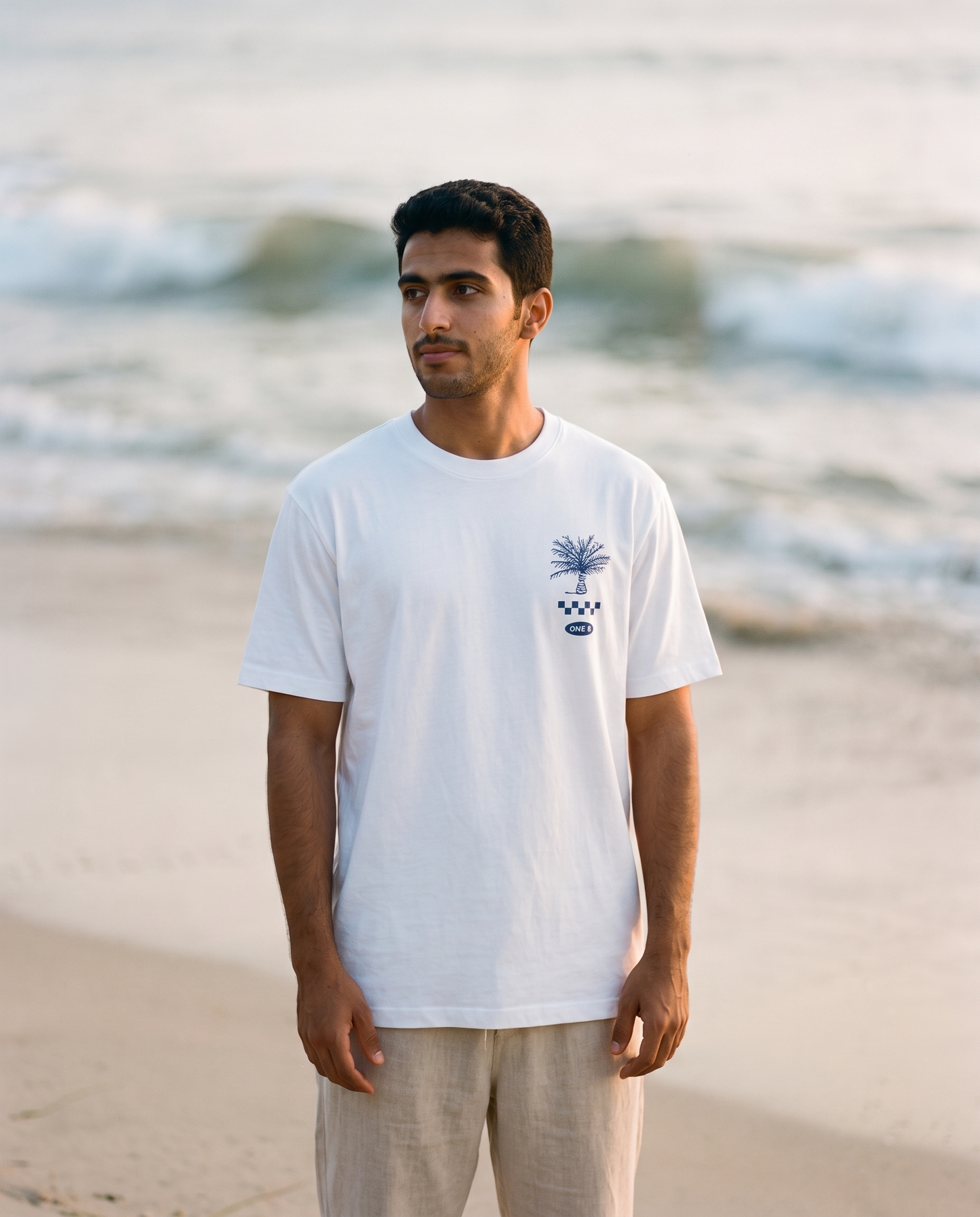 Salalah Surf Club Omani Surfer tee front chest print, male model, oversized fit