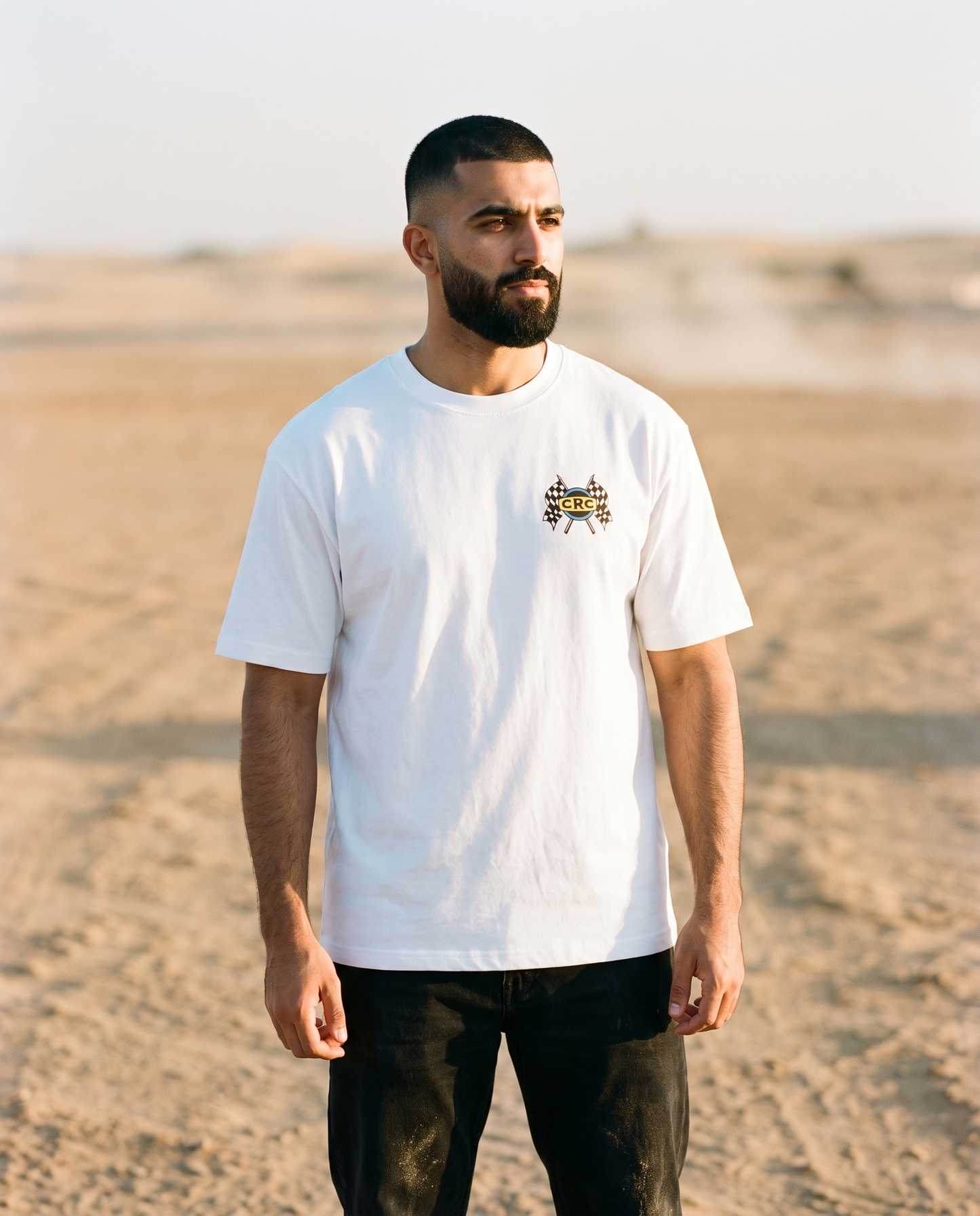 Winner's Circle Camel Racing Club tee front CRC flags chest print, male model