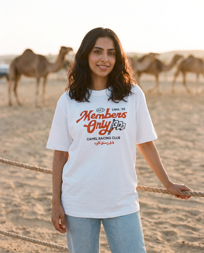 Members Only Camel Racing Club tee, female model at camel paddock with camels