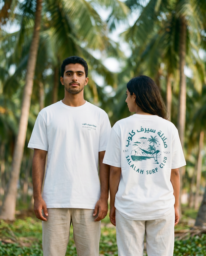 Coconut Palms tee worn by male and female models in a palm grove, front and back view