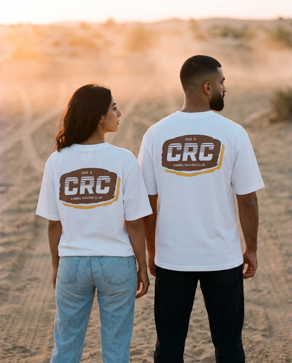 Motocross CRC tee back print worn by male and female models on a desert track at sunset