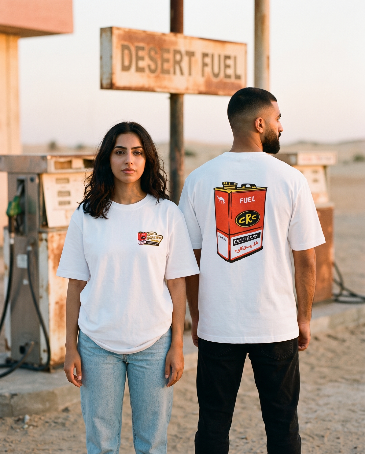 Fuel Can tee worn by male and female models at a retro desert petrol station, front and back view