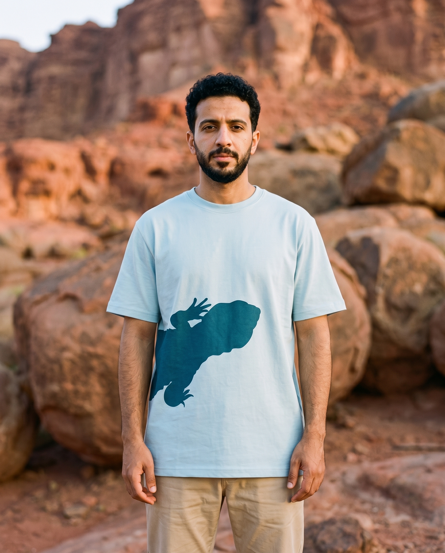 Uromastyx Dhab tee front lizard print worn by male model in red rocky desert