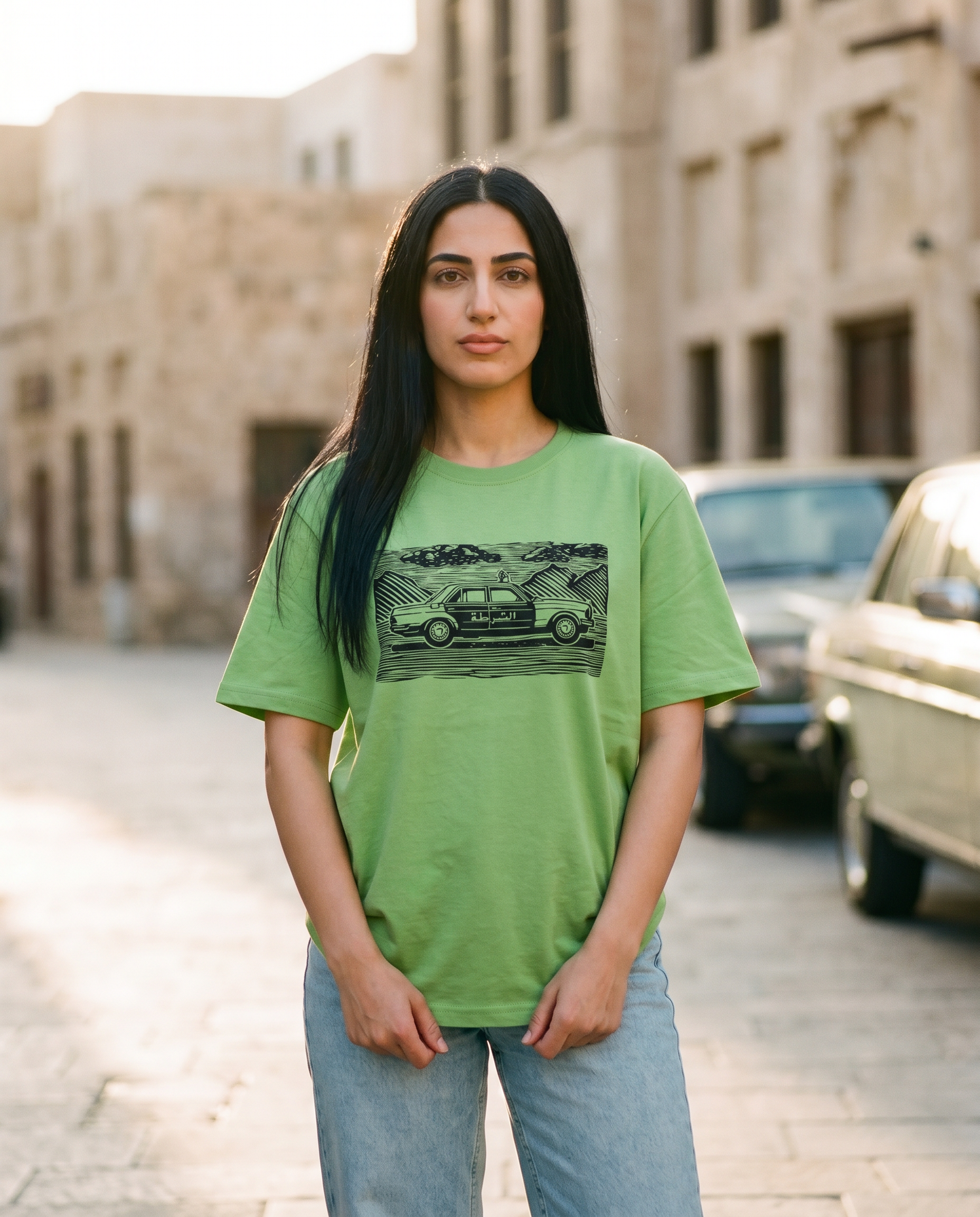 Vintage Dubai Linocut tee police car print worn by female model