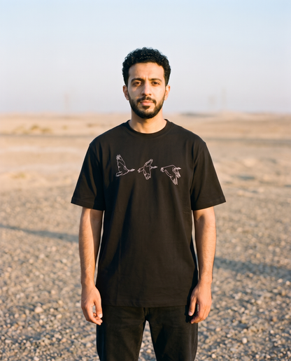 Houbara in Flight tee white bird line print worn by male model