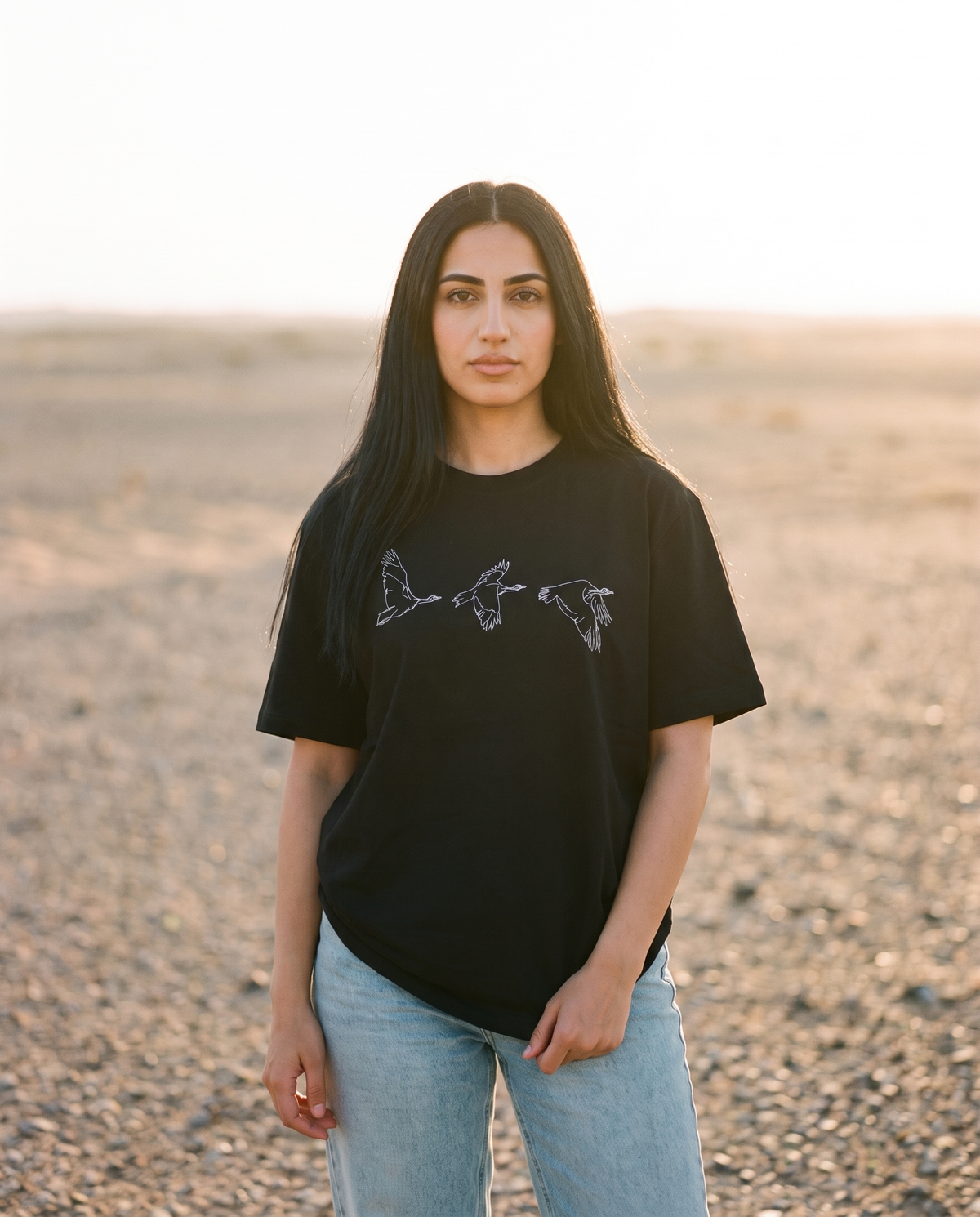 Houbara in Flight tee white bird line print worn by female model