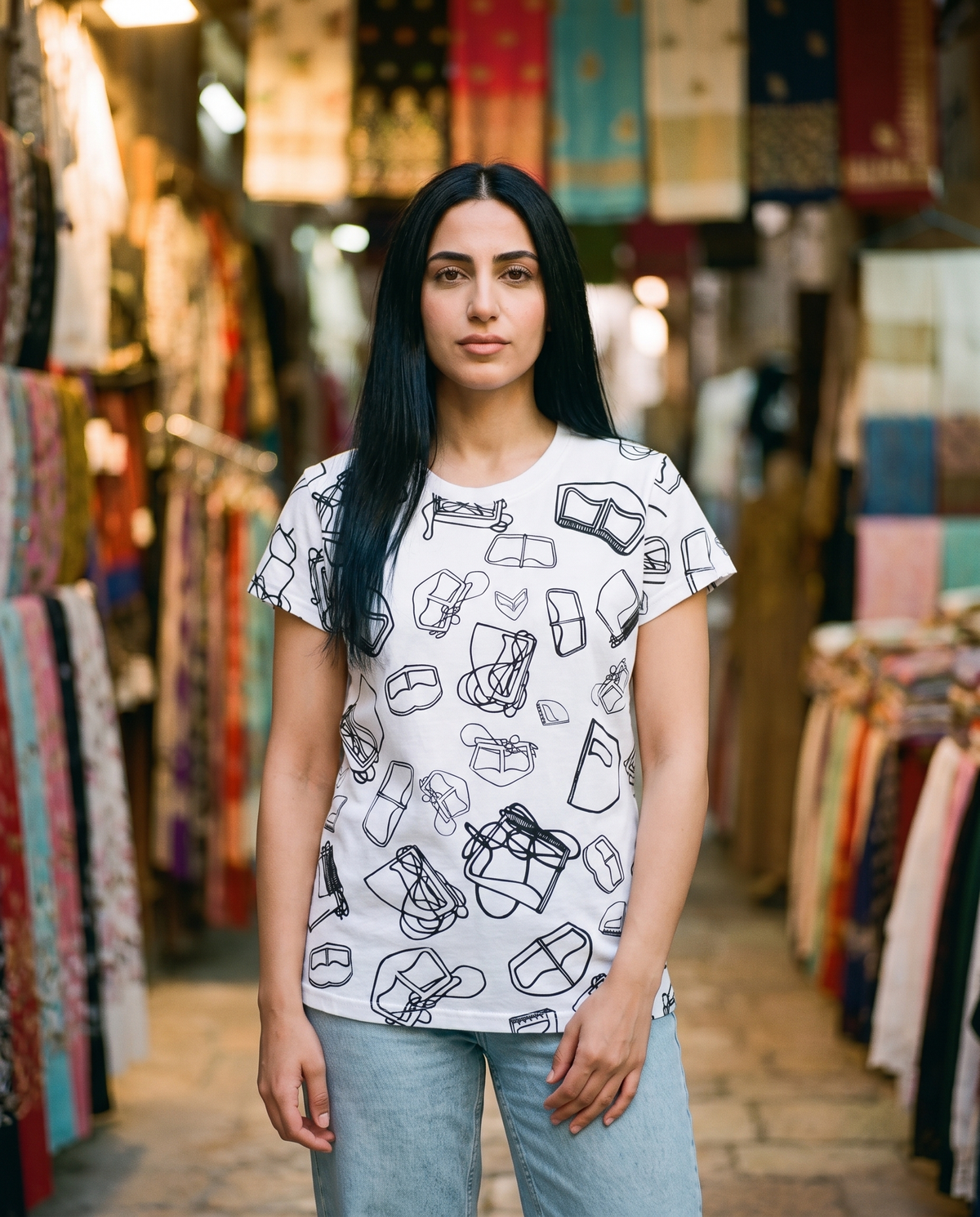 Burqa ladies tee all-over burqa line pattern worn by female model in a textile souq
