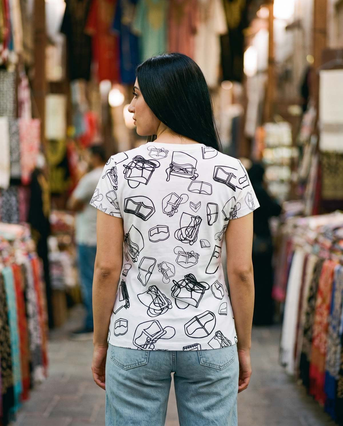 Burqa ladies tee all-over pattern back view worn by female model in a textile souq
