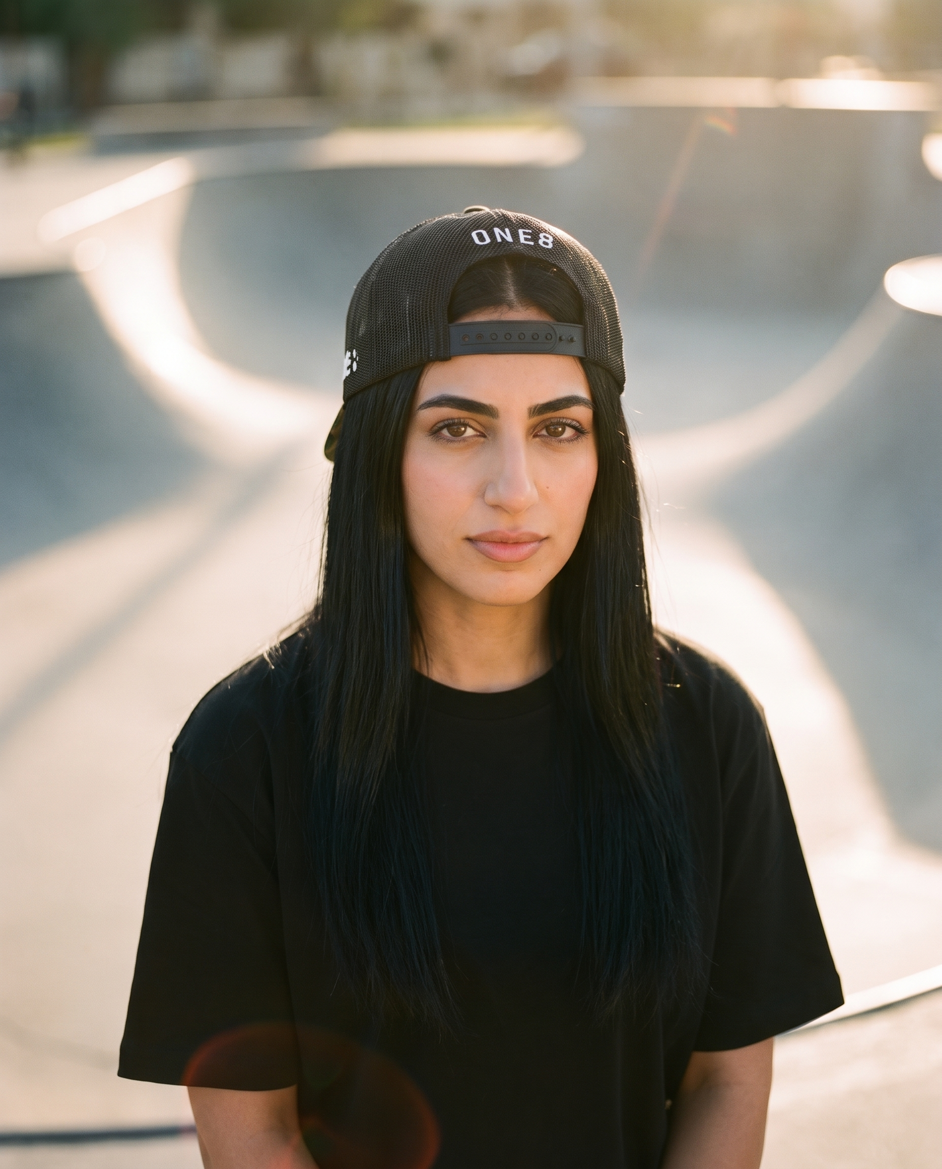 Middle East camo trucker worn backwards showing ONE8 mesh back at the skate park