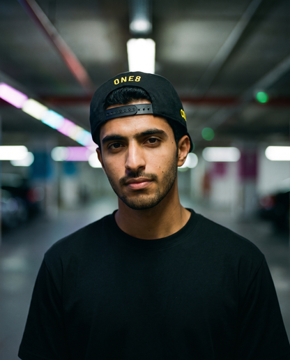 Headers Filter Bass flat brim snapback worn backwards - on model