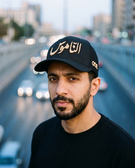 Al Namoos curved brim trucker worn frontwards - on model