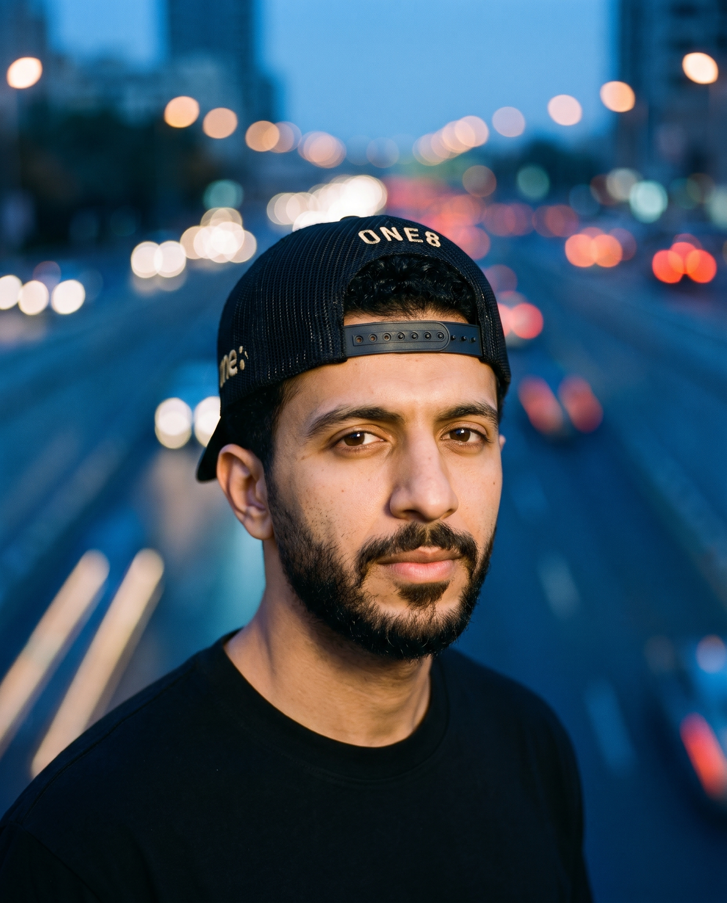 Al Namoos curved brim trucker worn backwards - on model