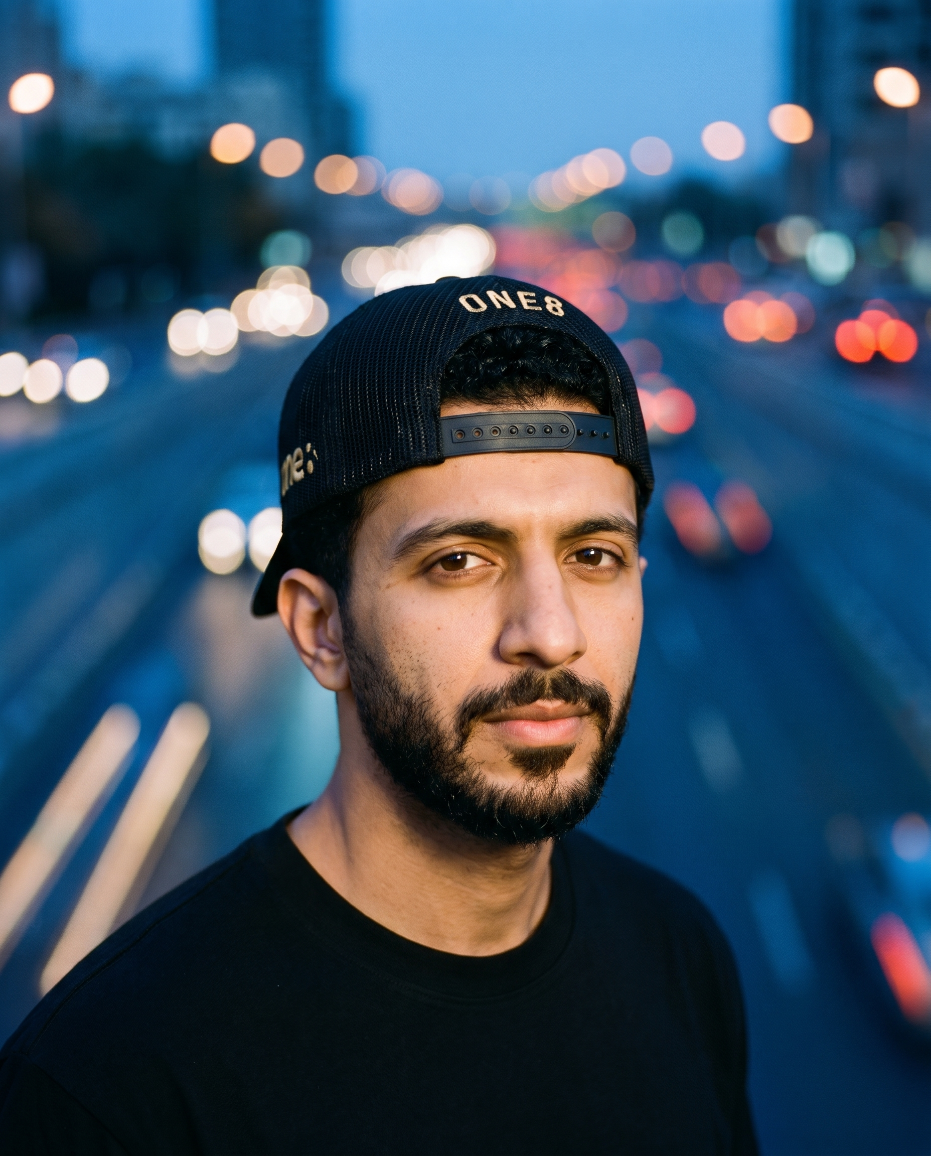 Al Namoos curved brim trucker worn backwards - on model