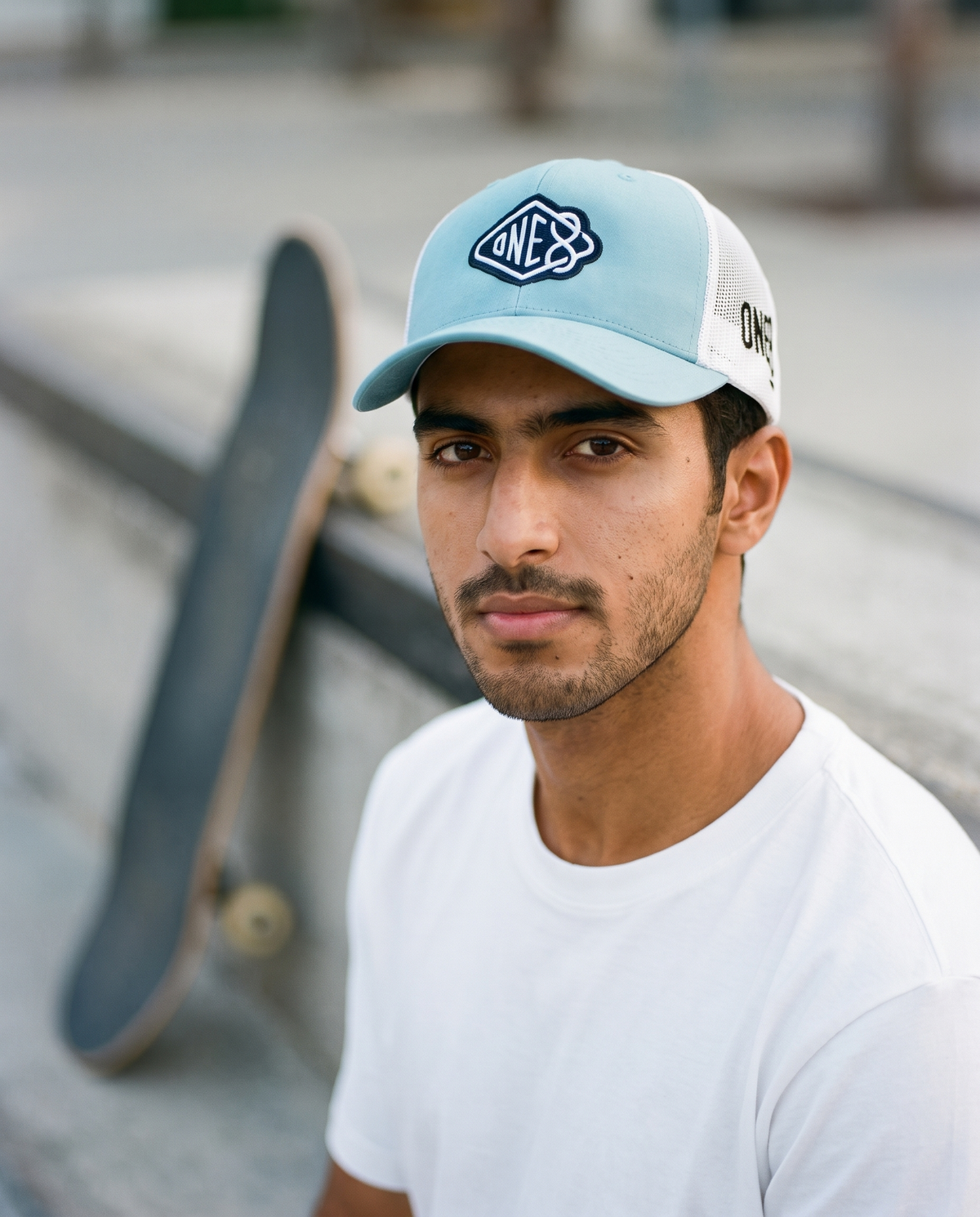 One8 Skate Logo trucker worn frontwards - on model