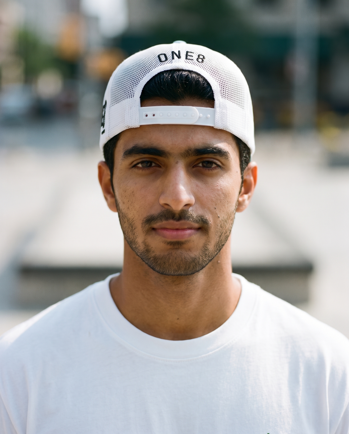 One8 Skate Logo trucker worn backwards - on model
